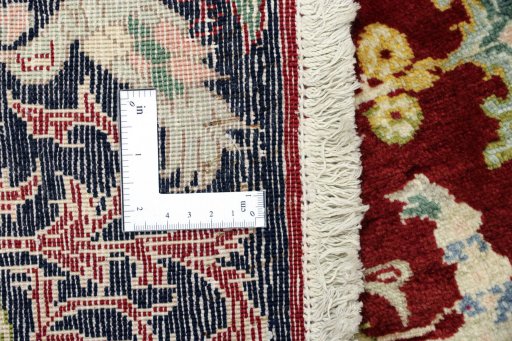Close-up detail of 1995s Kashan rug from Iran / Persia showing Wool weave