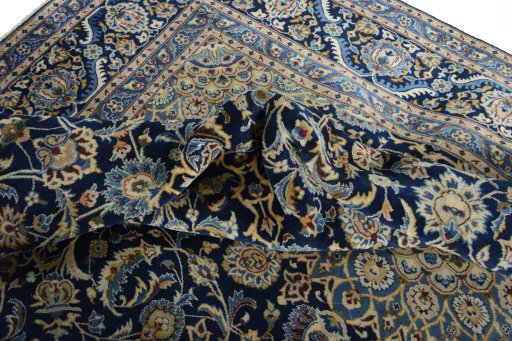 Surface texture of 2000s Kashmar rug with natural Wool and intricate pattern