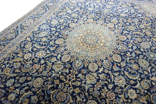 Backside of handmade 2000s Kashmar rug showing knot structure and weave density
