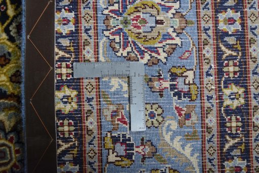 Backside of handmade 2000s Kashmar rug showing knot structure and weave density