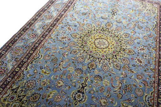 Backside of handmade 2000s Kashmar rug showing knot structure and weave density
