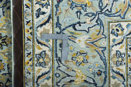 Backside of handmade 2000s Kashmar rug showing knot structure and weave density