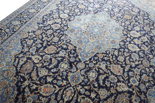 Backside of handmade 2000s Kashmar rug showing knot structure and weave density