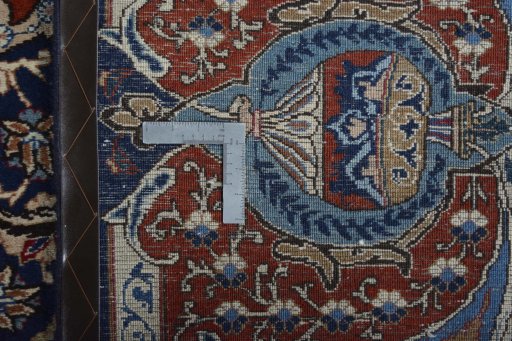 Backside of handmade 2000s Kashmar rug showing knot structure and weave density