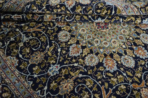 Close-up detail of 2000s Kashmar rug from Iran / Persia showing Wool weave