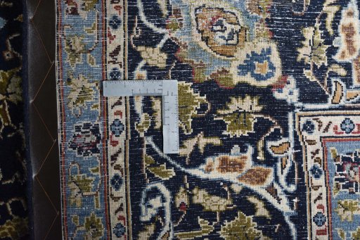 Backside of handmade 2000s Kashmar rug showing knot structure and weave density