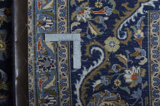 Backside of handmade 2000s Kashmar rug showing knot structure and weave density