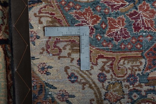 Backside of handmade 2000s Kashmar rug showing knot structure and weave density