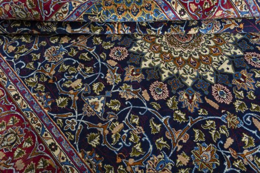 Close-up detail of 2000s Kashmar rug from Iran / Persia showing Wool weave