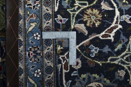 Backside of handmade 2000s Kashmar rug showing knot structure and weave density