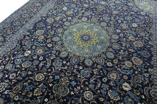 Backside of handmade 2000s Kashmar rug showing knot structure and weave density