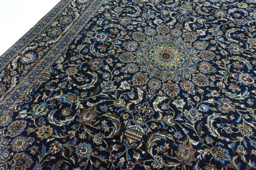 Backside of handmade 2000s Kashmar rug showing knot structure and weave density