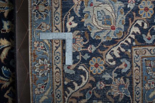 Backside of handmade 2000s Kashmar rug showing knot structure and weave density