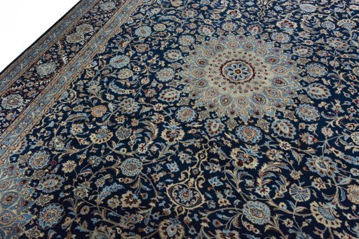 Backside of handmade 2000s Kashmar rug showing knot structure and weave density