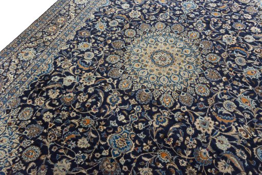 Backside of handmade 2000s Kashmar rug showing knot structure and weave density