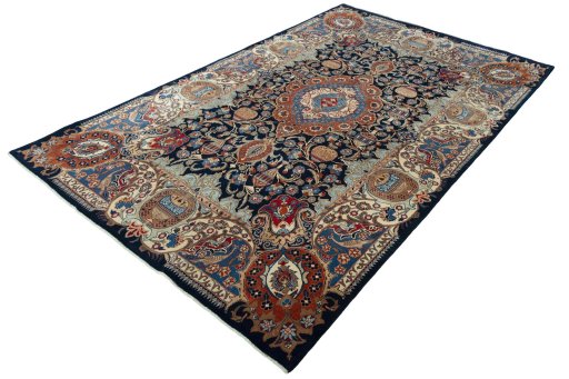 Corner detail of 1970s Kashmar rug showing border pattern and Wool pile