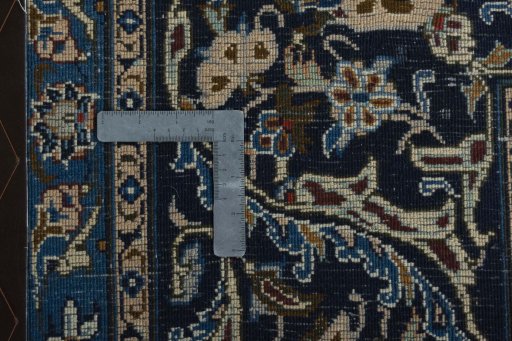 Backside of handmade 2000s Kashmar rug showing knot structure and weave density