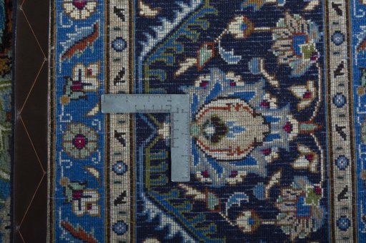 Backside of handmade 2000s Kashmar rug showing knot structure and weave density