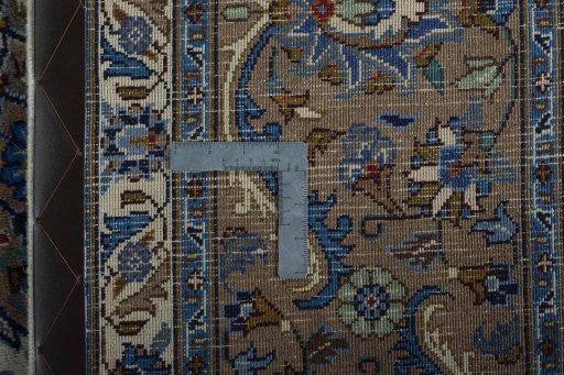 Backside of handmade 2000s Kashmar rug showing knot structure and weave density