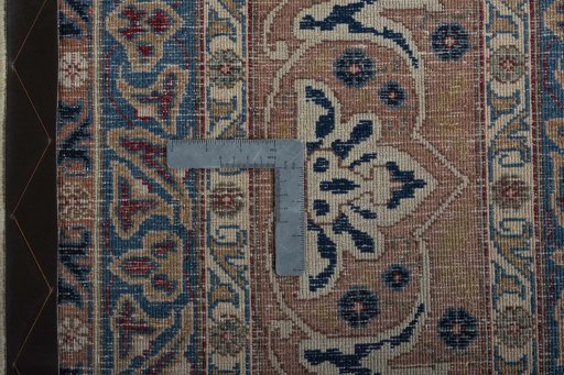 Backside of handmade 1970s Kashmar rug showing knot structure and weave density