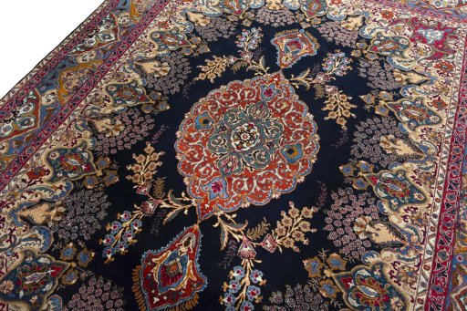 Backside of handmade 2000s Kashmar rug showing knot structure and weave density