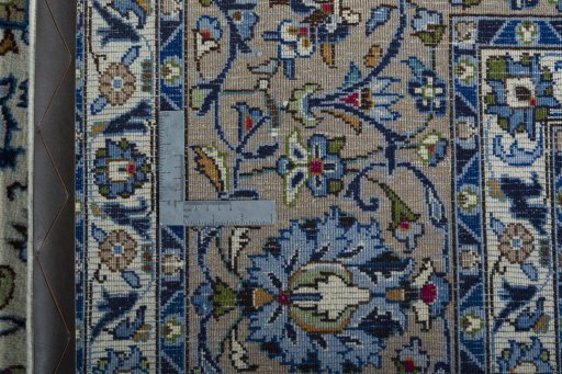 Backside of handmade 2000s Kashmar rug showing knot structure and weave density