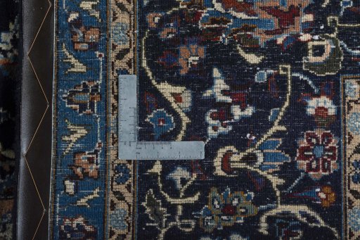 Backside of handmade New Kashmar rug showing knot structure and weave density
