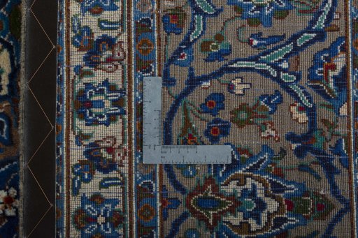 Backside of handmade 2000s Kashmar rug showing knot structure and weave density