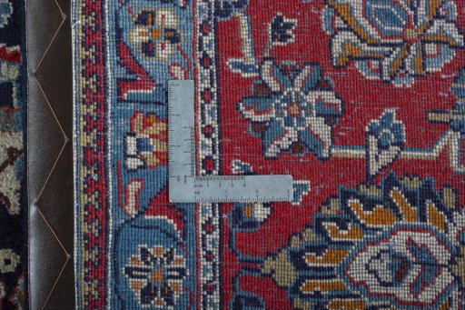 Backside of handmade 2000s Kashmar rug showing knot structure and weave density