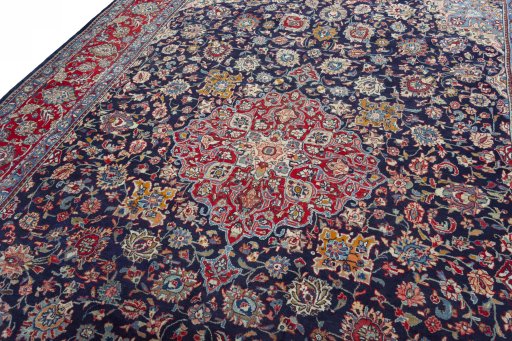Backside of handmade 2000s Kashmar rug showing knot structure and weave density
