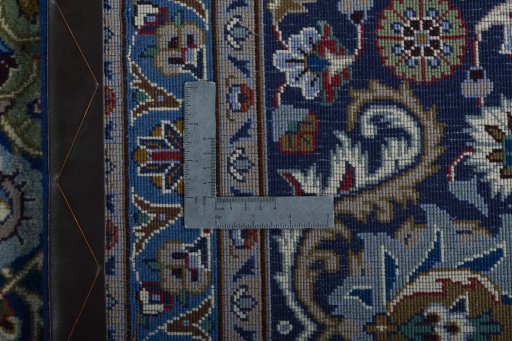 Backside of handmade 2000s Kashmar rug showing knot structure and weave density