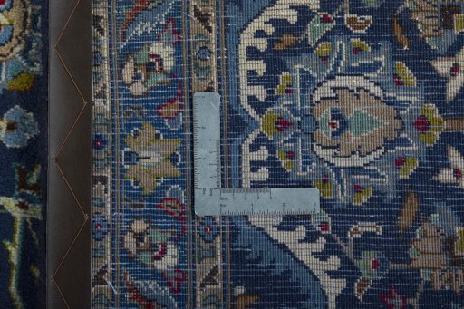 Backside of handmade 2000s Kashmar rug showing knot structure and weave density