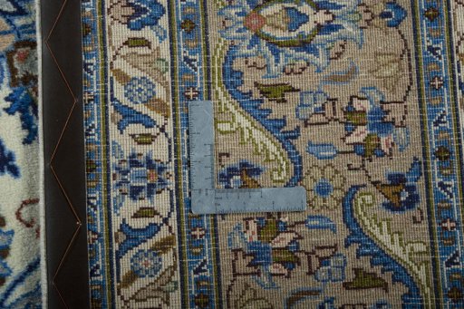 Backside of handmade 2000s Kashmar rug showing knot structure and weave density