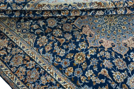 Close-up detail of 2000s Kashmar rug from Iran / Persia showing Wool weave