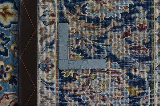 Backside of handmade 2000s Kashmar rug showing knot structure and weave density