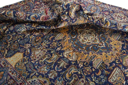 Backside of handmade 2000s Kashmar rug showing knot structure and weave density