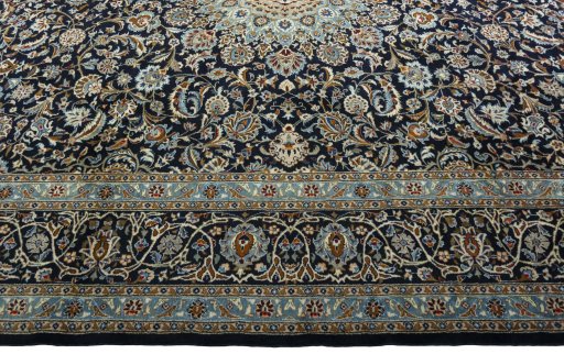 Corner detail of 2000s Kashmar rug showing border pattern and Wool pile
