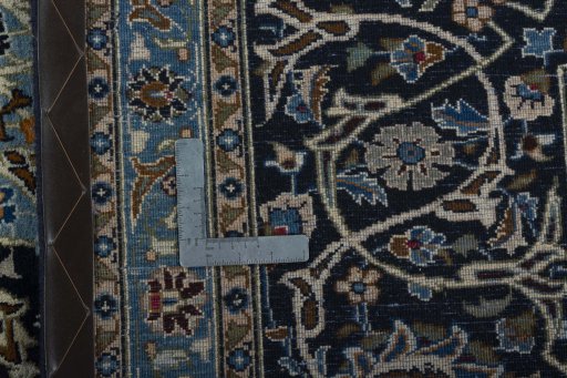 Backside of handmade 2000s Kashmar rug showing knot structure and weave density