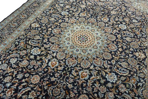 Backside of handmade 2000s Kashmar rug showing knot structure and weave density