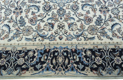 Corner detail of 2000s Kashmar rug showing border pattern and Wool pile