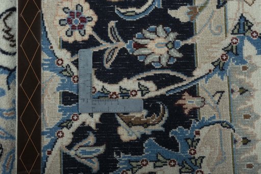 Backside of handmade 2000s Kashmar rug showing knot structure and weave density