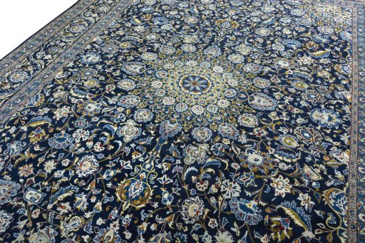 Backside of handmade 2000s Kashmar rug showing knot structure and weave density
