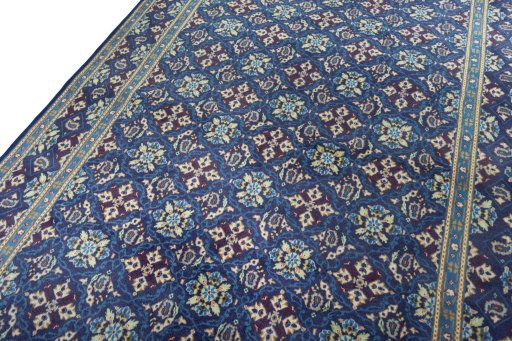 Backside of handmade 2000s Kashmar rug showing knot structure and weave density