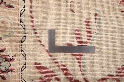 Corner detail of 2000s Kashmar rug showing border pattern and Wool pile