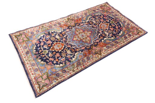 Close-up detail of 1975s Kashmar rug from Iran / Persia showing Wool weave