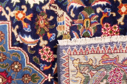 Close-up detail of 1975s Kashmar rug from Iran / Persia showing Wool weave