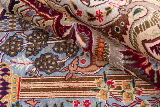 Backside of handmade 1960s Kashmar rug showing knot structure and weave density