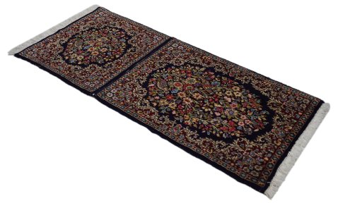 Corner detail of 1980s Kerman rug showing border pattern and Wool pile