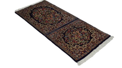 Close-up detail of 1970s Kerman rug from Iran / Persia showing Wool weave