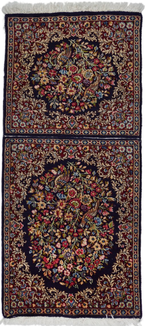 Full view of 1970s Kerman rug from Iran / Persia, 130 × 55 cm in Black tones